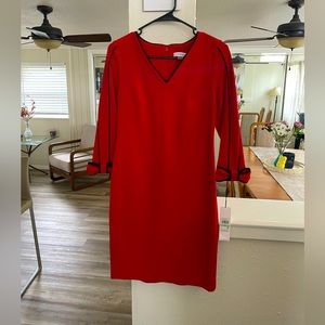 Red Calvin Klein dress with bow sleeves.